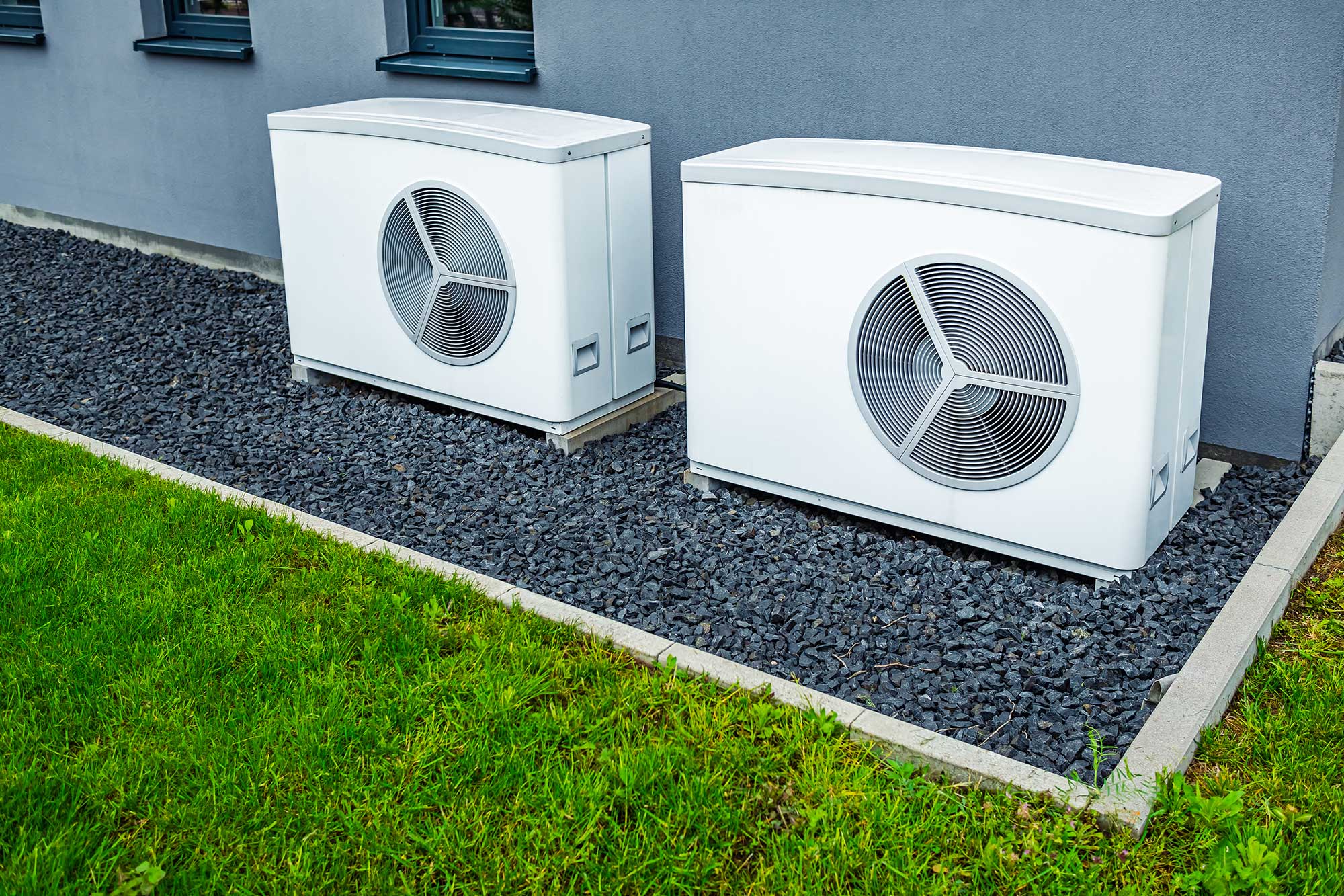 Outdoor heat pump system providing eco-friendly heating and cooling for a home.